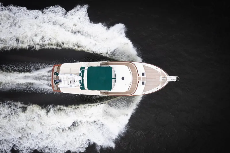 Slide: The Image of Aerial view of 2007 Fleming 55 yacht cruising through water, leaving a wake. - 4