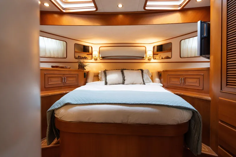 Slide: The Image of Laundry area and bunk beds inside a 2007 Fleming 55 yacht interior. - 47