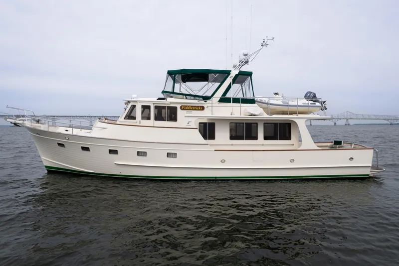 Slide: The Image of 2007 Fleming 55 yacht on water, side view with bridge in background. - 5