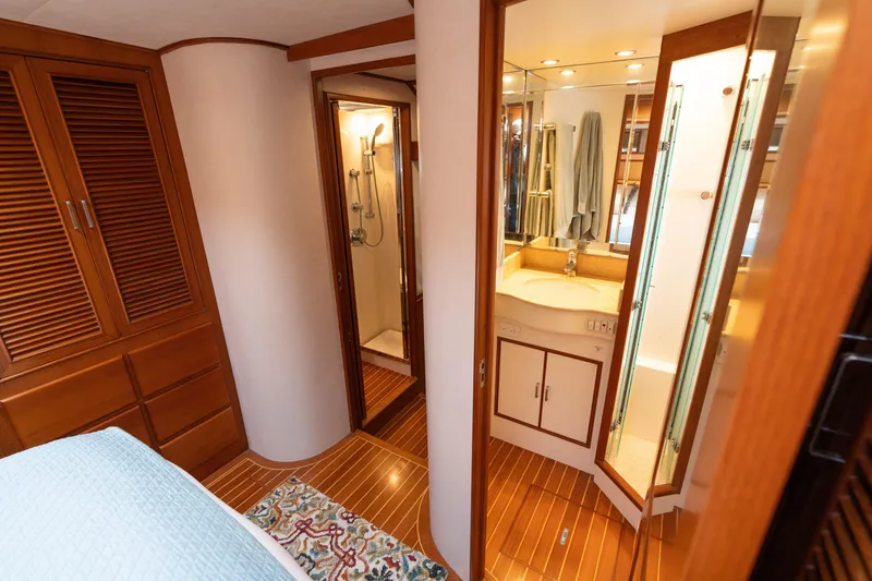 Slide: The Image of Luxurious interior of 2007 Fleming 55 yacht with wooden finishes and cozy bedroom. - 50
