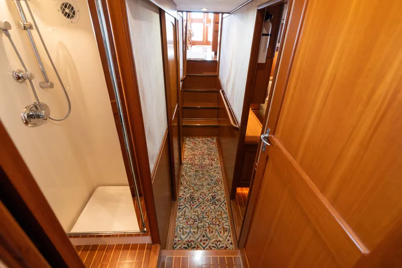 Slide: The Image of Luxurious 2007 Fleming 55 yacht bathroom with shower, sink, and toilet. - 52