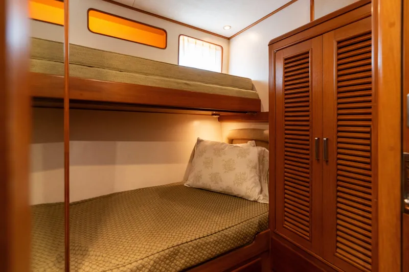 Slide: The Image of Interior of 2007 Fleming 55 yacht with wooden stairs and cozy bunk beds. - 60