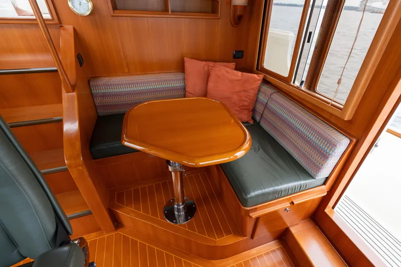 Slide: The Image of Luxurious helm of 2007 Fleming 55 yacht with navigation equipment and leather captain's chair. - 63