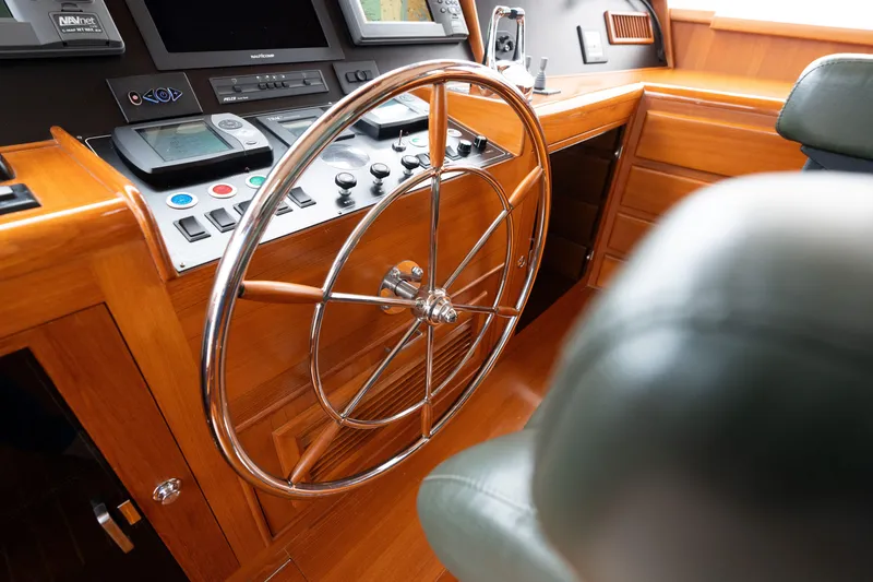 Slide: The Image of Steering wheel and control panel of 2007 Fleming 55 yacht cockpit. - 70