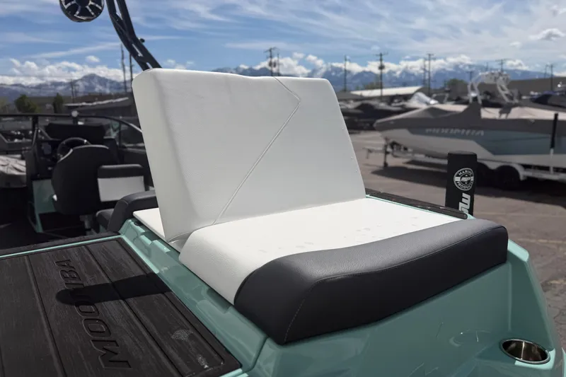Slide: The Image of 2025 Moomba Tykon boat seat with sleek design, outdoor setting, and mountain backdrop. - 10
