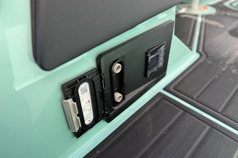 Slide: The Image of Control panel on 2025 Moomba Tykon boat, featuring digital display and connectors. - 14