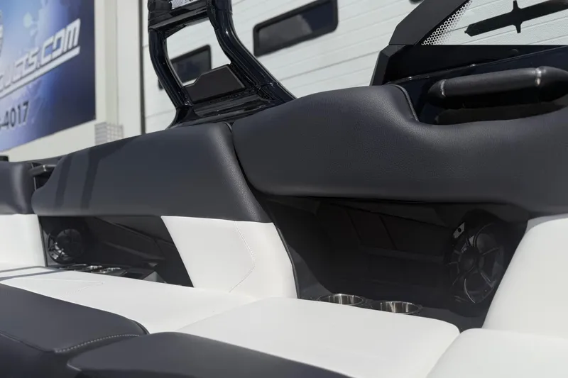 Slide: The Image of 2025 Moomba Tykon boat interior with sleek black and white seating design. - 15