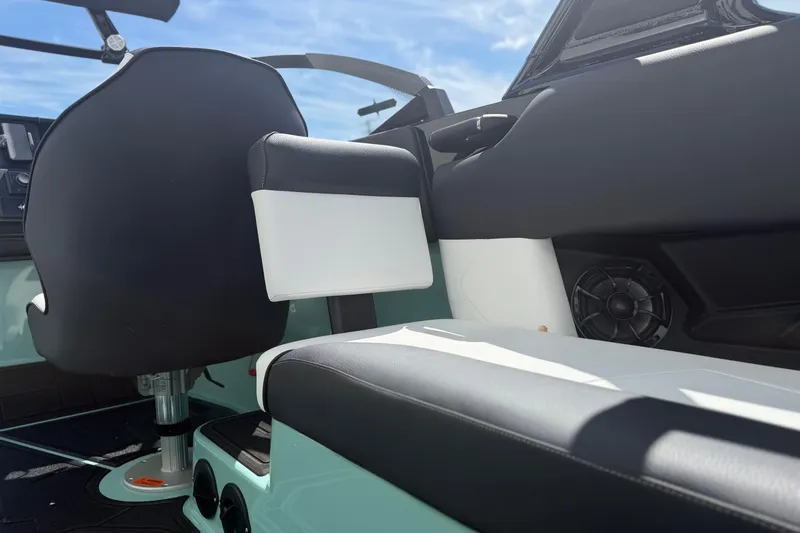 Slide: The Image of Interior of 2025 Moomba Tykon boat featuring modern seating and audio system. - 16