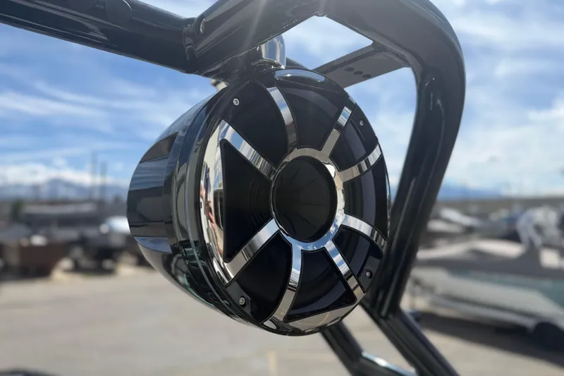 Slide: The Image of 2025 Moomba Tykon boat speaker with sleek chrome accents under a clear sky. - 19