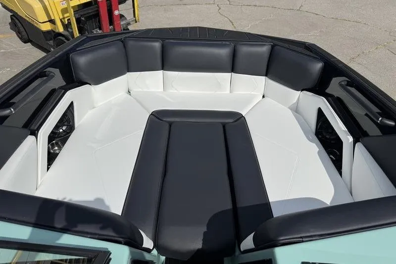 Slide: The Image of 2025 Moomba Tykon boat interior with black and white seating. - 3