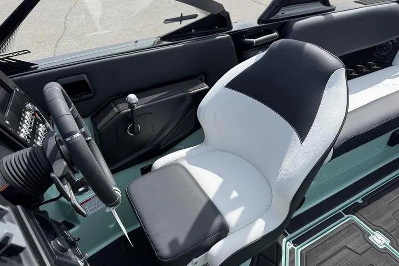 Slide: The Image of 2025 Moomba Tykon interior with sleek steering wheel and modern seating design. - 9