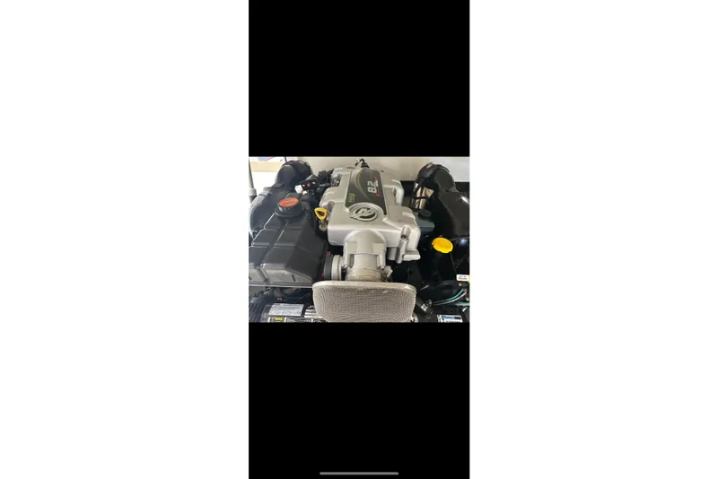 Slide: The Image of Engine of a 2012 Cobalt A25 boat, featuring an 8.2L V8 engine. - 10