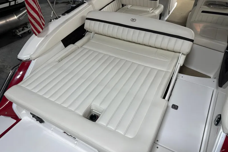 Slide: The Image of 2012 Cobalt A25 boat with white leather seating and American flag detail. - 15