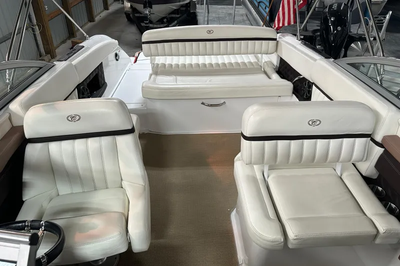 Slide: The Image of 2012 Cobalt A25 boat interior with white leather seating and elegant design. - 17