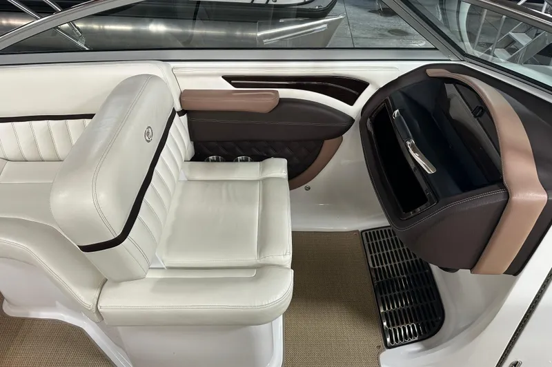 Slide: The Image of Luxurious interior of a 2012 Cobalt A25 boat with white leather seating. - 28