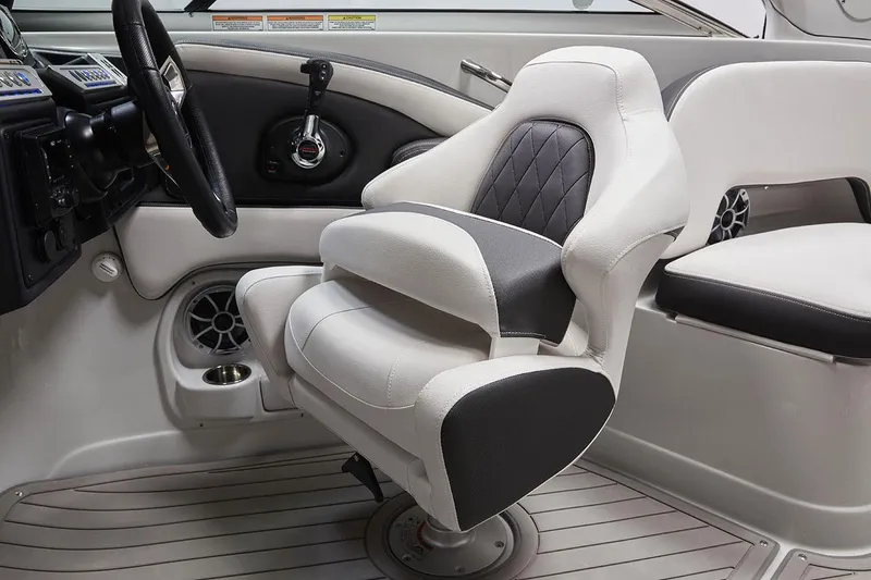 Slide: The Image of Captain's seat in 2026 Crownline 270 XSS boat, featuring modern design and controls. - 4