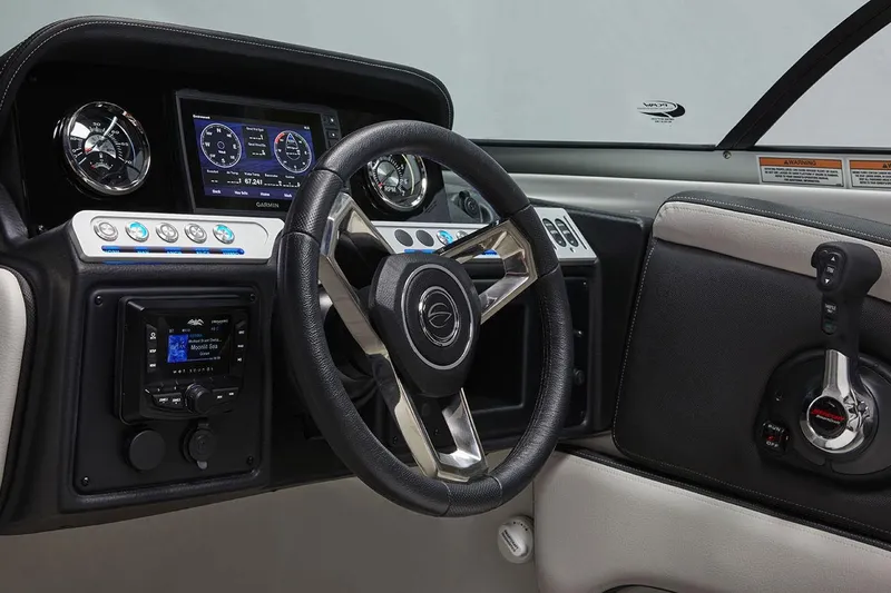 Slide: The Image of 2026 Crownline 270 XSS boat dashboard with steering wheel and control panel. - 5