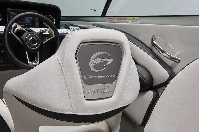 Slide: The Image of 2026 Crownline 270 XSS boat interior with branded seat and steering wheel. - 8