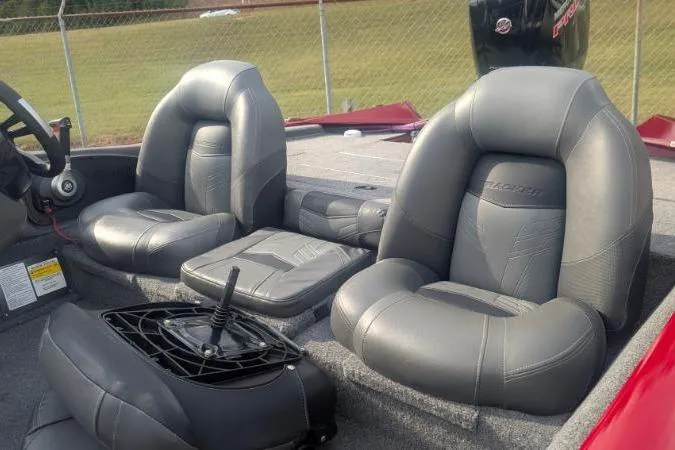 Slide: The Image of 2022 Tracker Pro Team 190 TX Tournament Edition boat interior with gray leather seats. - 8