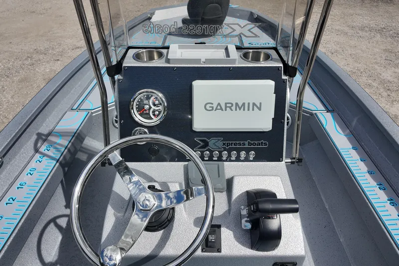 Slide: The Image of 2026 Xpress H22B Bay boat dashboard with Garmin navigation system and steering wheel. - 12