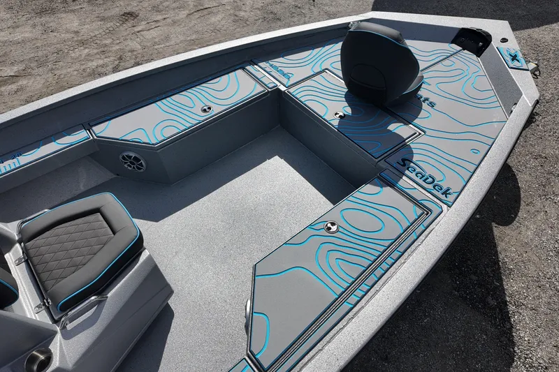 Slide: The Image of 2026 Xpress H22B Bay boat interior with stylish seating and SeaDek flooring. - 13