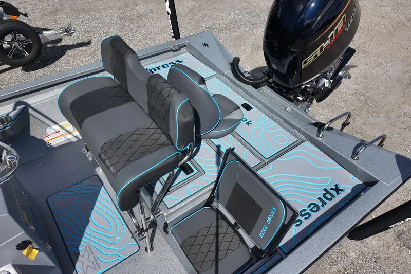 Slide: The Image of 2026 Xpress H22B Bay boat interior with stylish seating and Yamaha engine. - 17