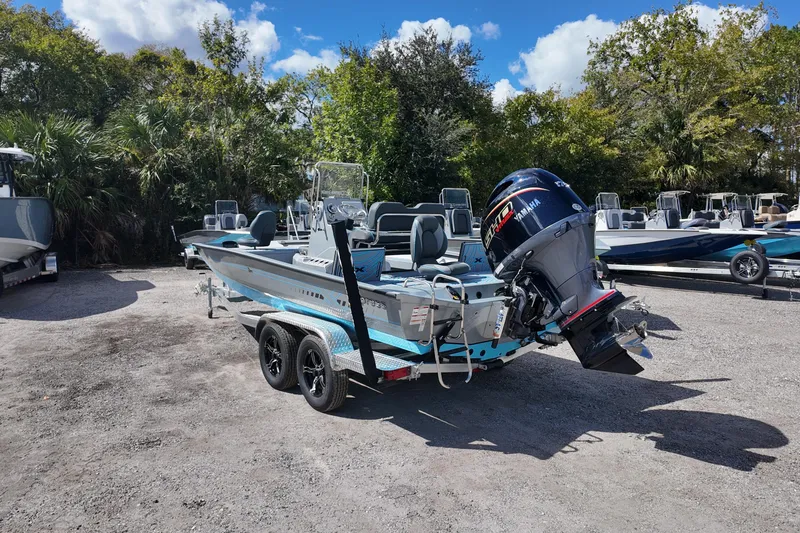 Slide: The Image of 2026 Xpress H22B Bay boat with Yamaha engine on trailer, parked outdoors. - 6