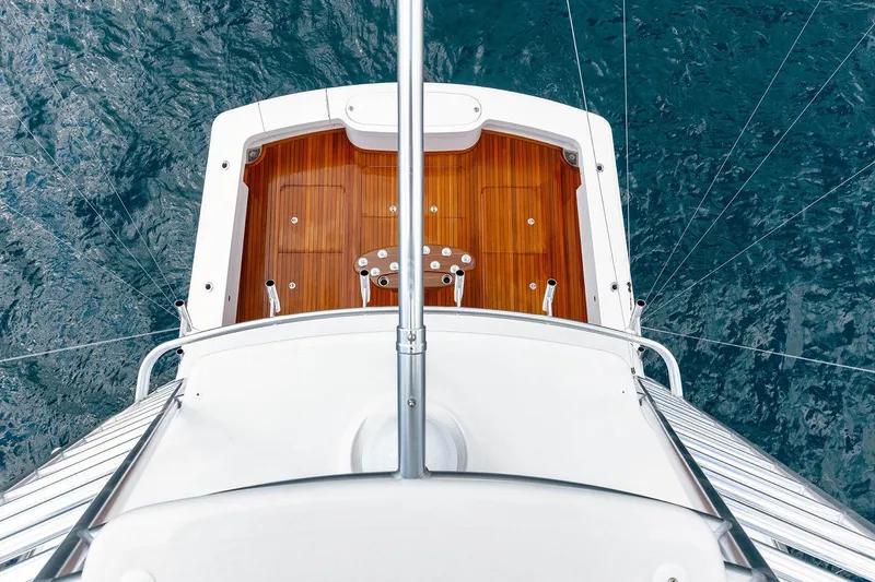 Slide: The Image of Aerial view of 2026 Viking 58 Convertible yacht deck over ocean. - 12