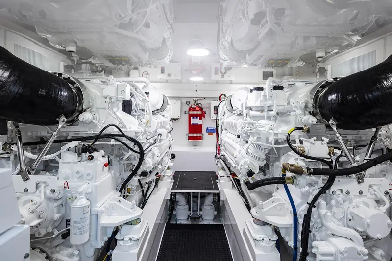 Slide: The Image of Engine room of 2026 Viking 58 Convertible yacht, featuring advanced machinery and equipment. - 19