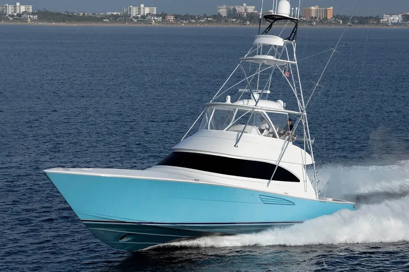 Slide: The Image of 2026 Viking 58 Convertible yacht cruising on open water. - 5