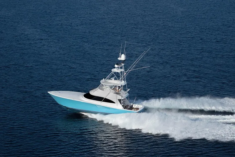 Slide: The Image of 2026 Viking 58 Convertible yacht cruising on open blue water. - 6