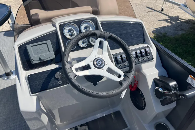 Slide: The Image of 2026 Sylvan Mirage 820 CLZ DH boat dashboard with steering wheel and control panel. - 11