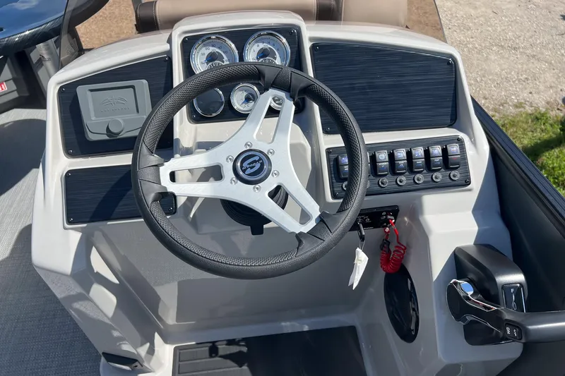 Slide: The Image of 2026 Sylvan Mirage 820 CLZ DH boat dashboard with steering wheel and control panel. - 12