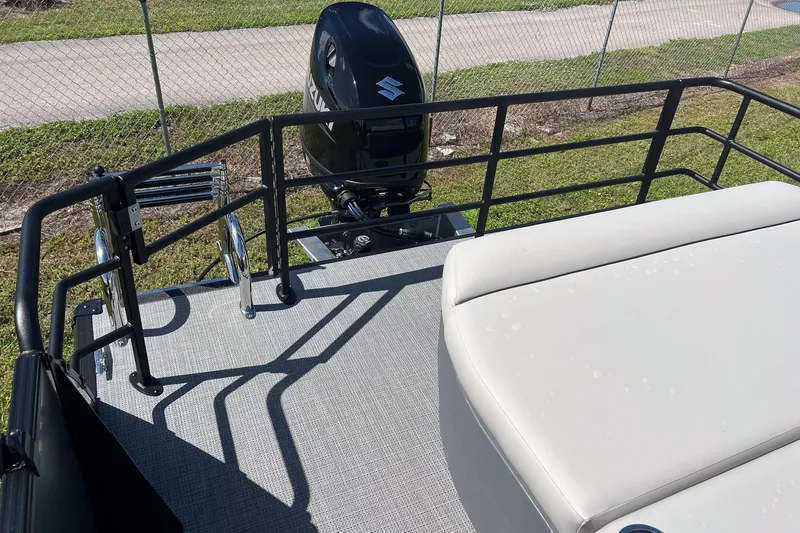 Slide: The Image of 2026 Sylvan Mirage 820 CLZ DH boat deck with Suzuki outboard motor. - 19