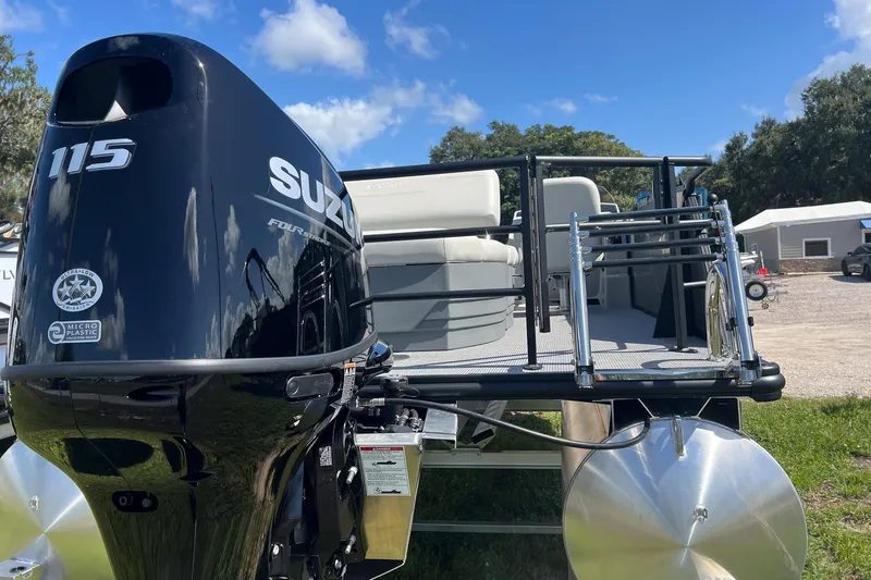 Slide: The Image of 2026 Sylvan Mirage 820 CLZ DH pontoon boat with Suzuki 115 engine, outdoor setting. - 5