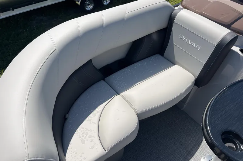 Slide: The Image of Luxurious seating on 2026 Sylvan Mirage 820 CLZ DH boat, featuring sleek design and comfort. - 7