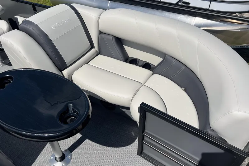 Slide: The Image of Luxurious seating on 2026 Sylvan Mirage 820 CLZ DH pontoon boat with sleek table design. - 8