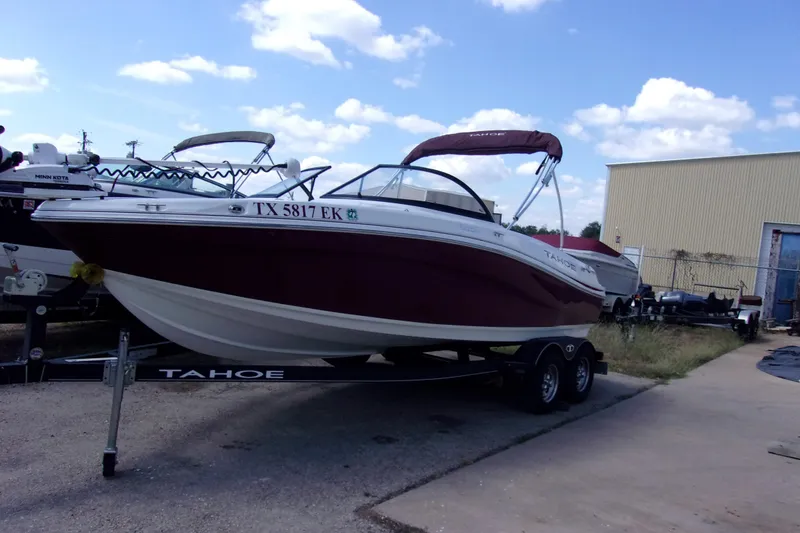 Slide: The Image of 2019 Tahoe 500 TF boat on trailer, parked outdoors under a blue sky. - 1