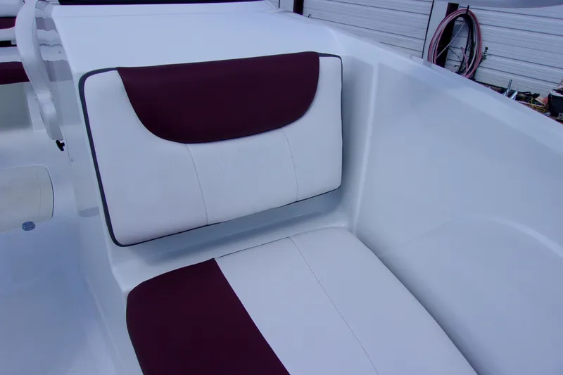 Slide: The Image of 2019 Tahoe 500 TF boat interior with white and maroon seating. - 11