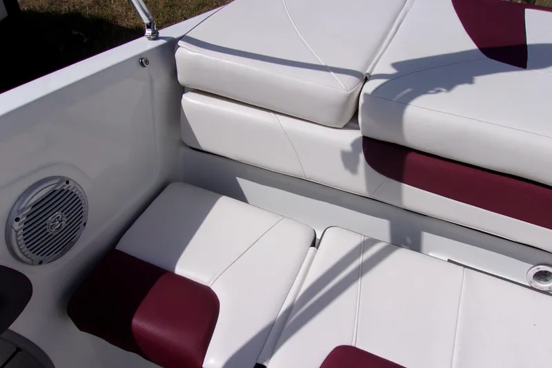 Slide: The Image of 2019 Tahoe 500 TF boat interior with white and maroon seating, speaker detail. - 13