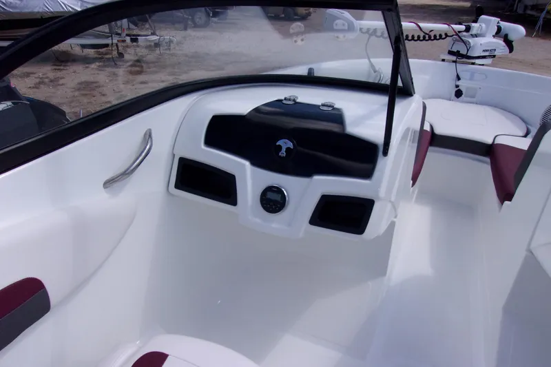 Slide: The Image of Interior of 2019 Tahoe 500 TF boat, featuring sleek dashboard and seating. - 6
