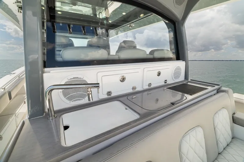 Slide: The Image of Luxury yacht HCB 53 Sueños 2023 with sleek outdoor kitchen and ocean view. - 33