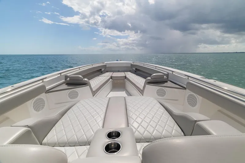 Slide: The Image of Luxurious 2023 HCB 53 Sueños boat interior with quilted seating on open water. - 35