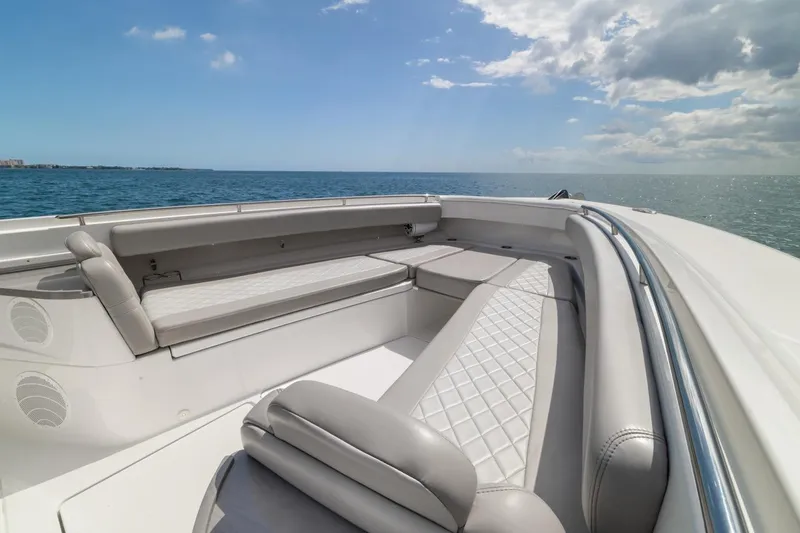 Slide: The Image of Luxurious seating on 2023 HCB 53 Sueños boat, ocean view, clear sky. - 37