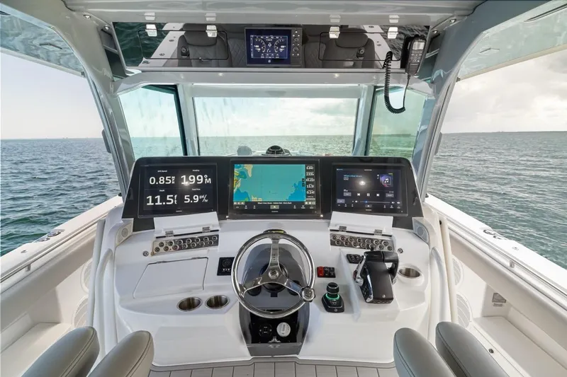 Slide: The Image of Helm of 2023 HCB 53 Sueños boat with advanced navigation displays. - 45
