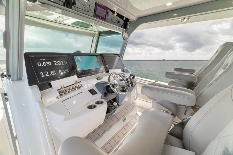 Slide: The Image of Interior of 2023 HCB 53 Sueños boat with advanced navigation system and luxurious seating. - 46