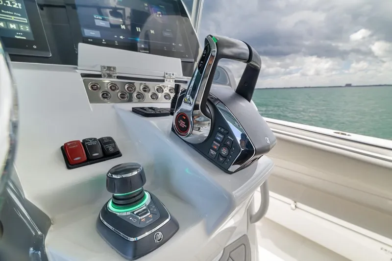 Slide: The Image of Control panel of 2023 HCB 53 Sueños boat with throttle and joystick. - 50