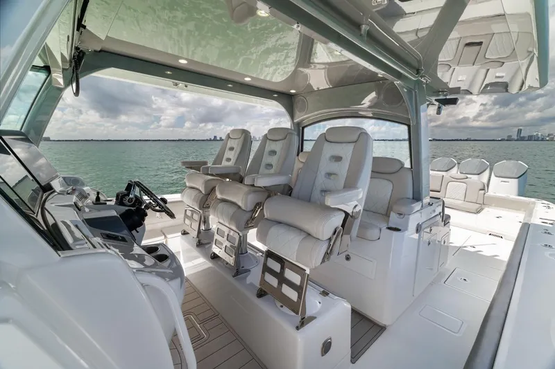 Slide: The Image of Luxurious interior of 2023 HCB 53 Sueños boat with plush seating and modern helm. - 51