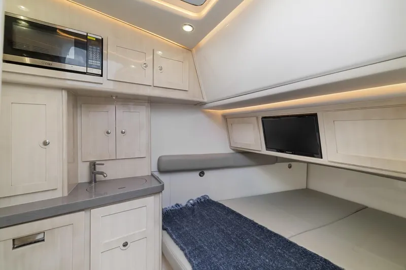 Slide: The Image of Luxurious interior of 2023 HCB 53 Sueños yacht with kitchenette and cozy sleeping area. - 55