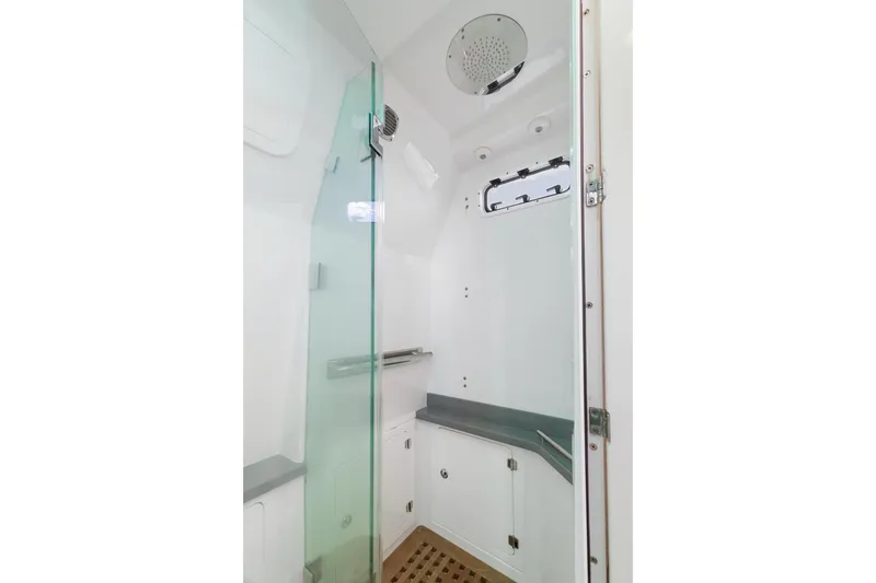 Slide: The Image of Modern shower area in 2023 HCB 53 Sueños boat with glass door and sleek design. - 58